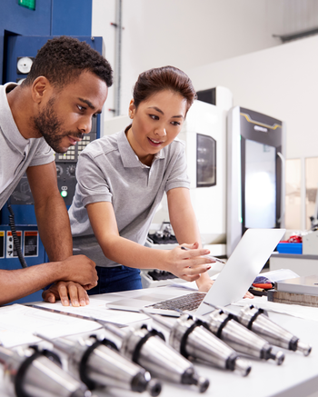 Two people looking at equipment