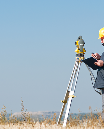 Person outside with equipment and clipboard