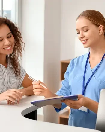 Medical Assistant helping a patient in a clinic
