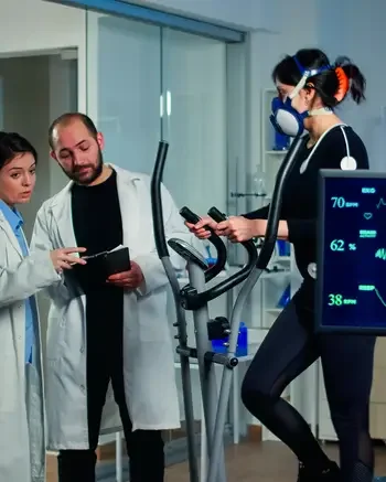 People in exercise lab analyzing monitors