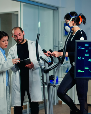 People in exercise lab analyzing monitors