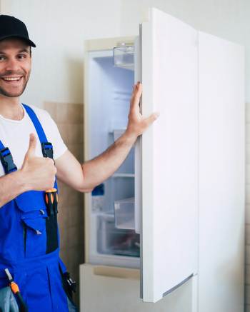 Repair man working on refrigerator