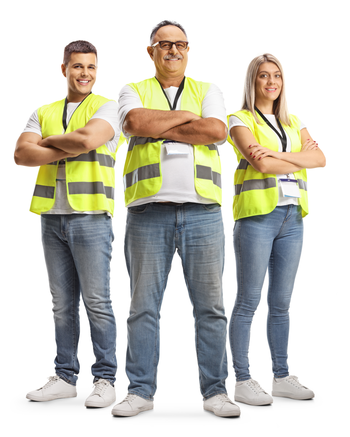 Three people standing together all wearing safety vests
