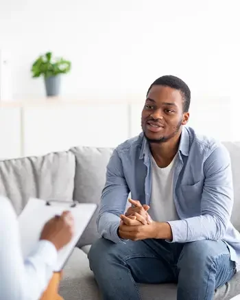 Mental Health Technician working with a client in an office