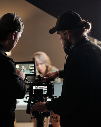 Videographers recording in a studio