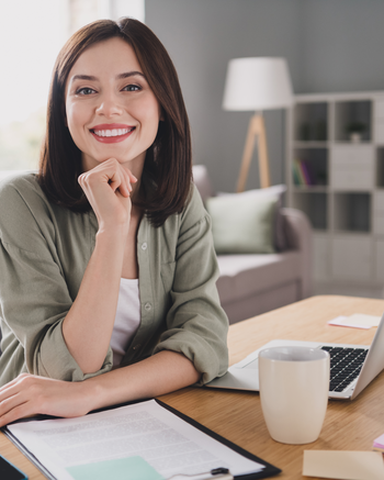 Woman sitting at desk smiling