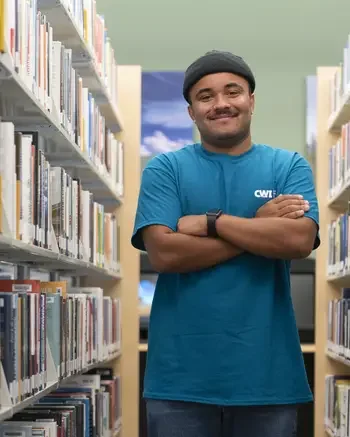Man standing in library.