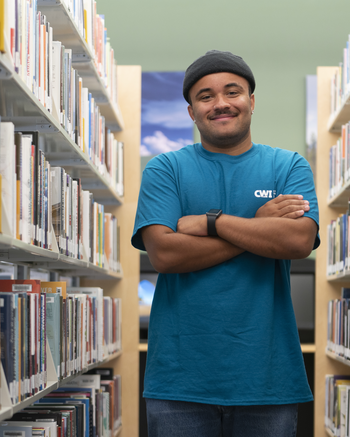 Man standing in library.