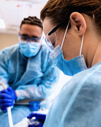 Two people in dental scrubs