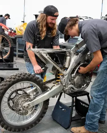 Technicians working on a motorcycle