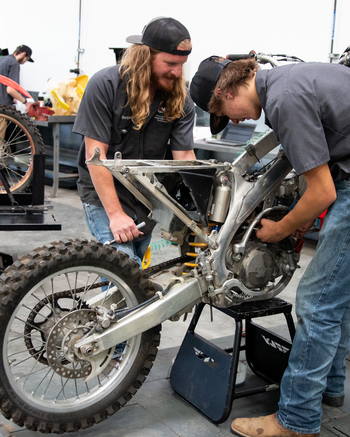 Technicians working on a motorcycle