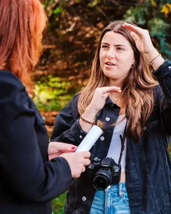Photographer speaking with a business client. 