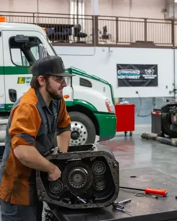 Heavy-Duty Truck Technician working on truck engine
