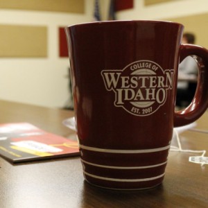 CWI mug sitting on a conference table with brochures