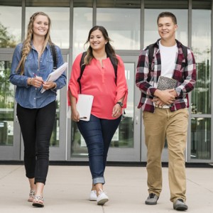 CWI students walking in front of the academic building