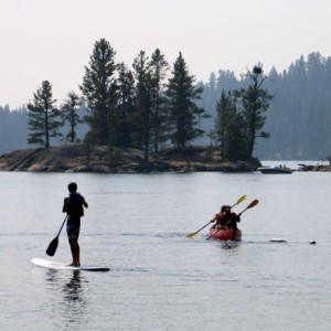 Students paddle boarding and kayaking