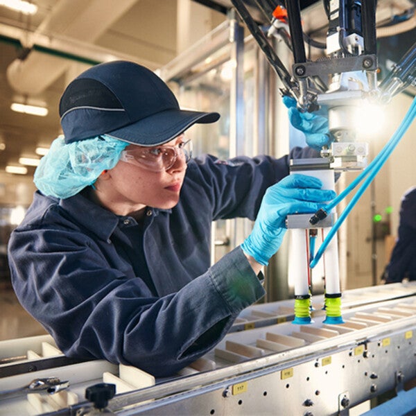 Student working in lab on machinery