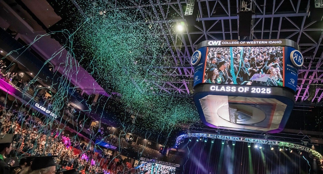 Confetti falls at a celebration for graduates at the conclusion of a commencement ceremony.