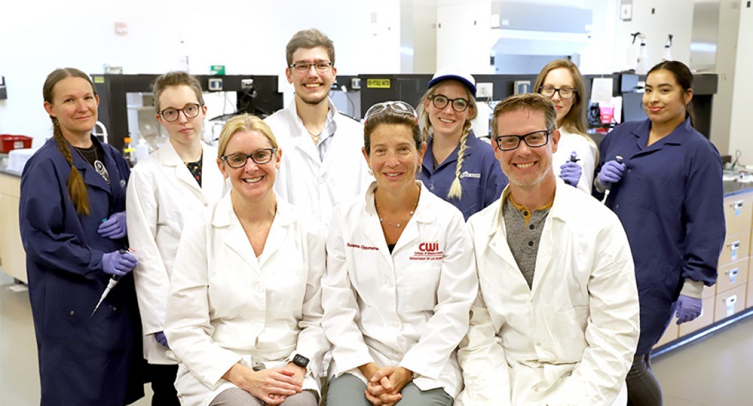 CWI INBRE students and instructors pose for a photo in a lab