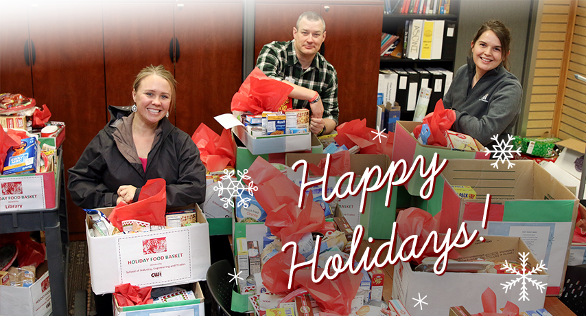 Staff putting together holiday care packages for students