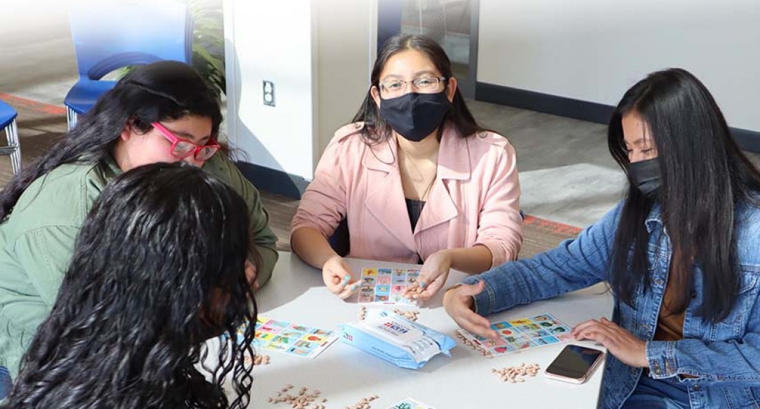 Students wearing masks playing Loteria