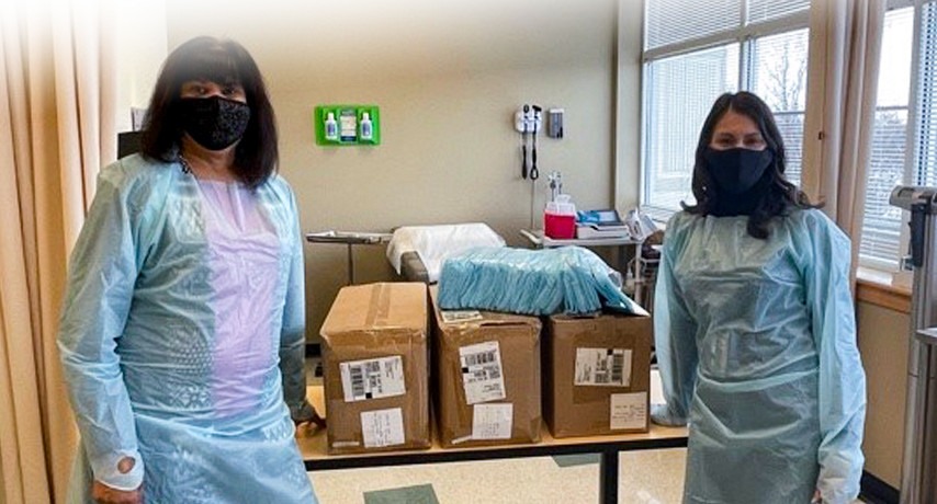 Sabina Omair (Health Professions) and Angela Zaugg (Occupational Therapy Assistant Instructor) in isolation gowns