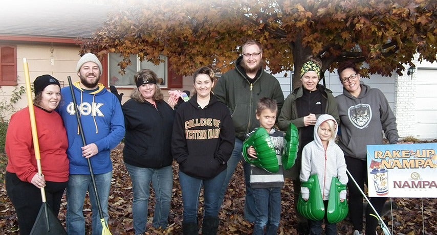 Members of Beta Sigma Pi participate in Rake-Up Nampa